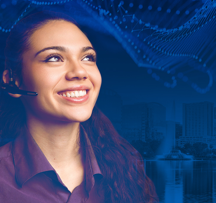 Enhancing Customer Experience Thought Leadership Article: How EX plus AI equals CX. Image shows a female CX representative smiling as she provides excellent customer service.